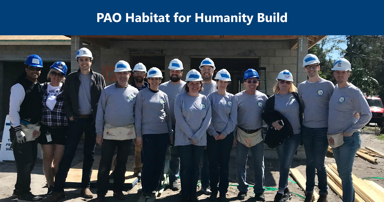 Habitat for Humanity Build. Image: Staff members from the Property Appraiser's Office stand in front of a house for Habitat for Humanity. 